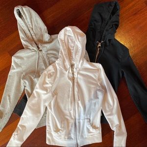 THREE fitted zip up hoodies